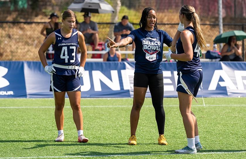 Select Bowl coach leading girl Select Team athletes during a training-camp style practice.